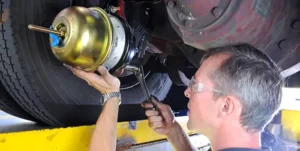 Technician working on the brake chamber | Braking System | Martinsburg Service Center, Martinsburg WV