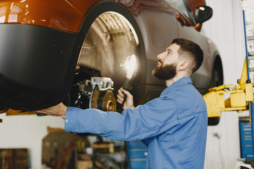Automotive Technician working on a vehicles brakes | Brake Pads and Rotors | Martinsburg Service Center, Martinsburg WV