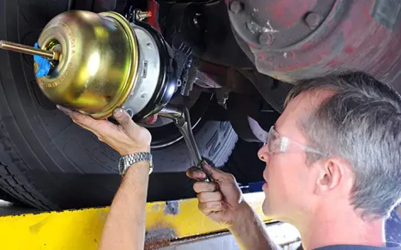 Technician working on the brake chamber | Braking System | Martinsburg Service Center, Martinsburg WV